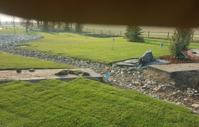 Yard Grading with white Rocks